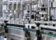 “Eye drop filling machine with bottle filling and dropper insertion stations” — use only if these features are visible.